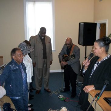 Co-Pastor Rev. Berta Newsome-Jones singing at Living Stones Ministries and Worship Center