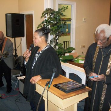 Pastor and Co-Pastor leading congregation at Living Stones Ministries and Worship Center
